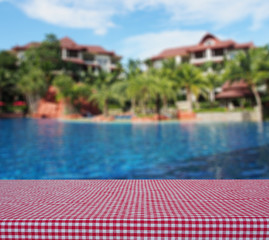 Table beside swimming pool