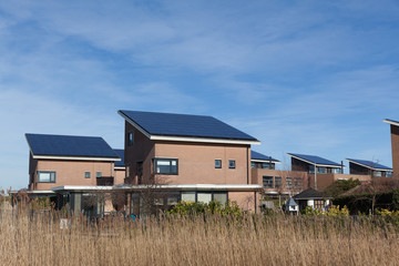 Family house with solar panels for alternative energy