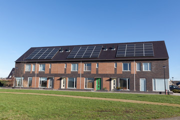 Family house with solar panels for alternative energy