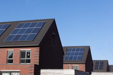 Fototapeta premium Close up of solar panels on family houses producing alternative