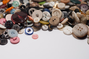 set of different buttons. tablewith copy space. close up.