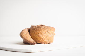 Cinnamon rolls on the wooden background