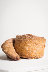 Cinnamon rolls on the wooden background