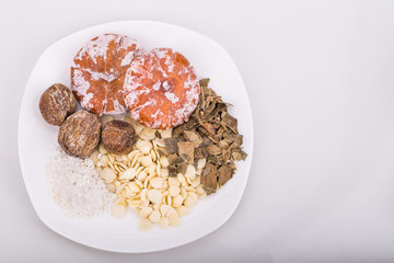 Ingredients for Chinese apricot kernel, tangerine, loquat leaf, and chin pui  soup for relief of cough 
