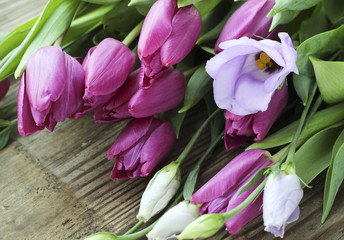 Bouquet of fresh purple tulips and eustoma flower