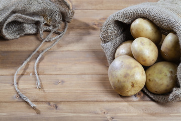 Organic potatoes bag on the wooden table