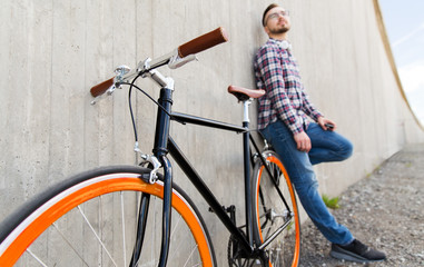 Obraz na płótnie Canvas close up of hipster fixed gear bike and man