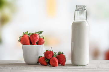 Strawberries and a bottle of milk