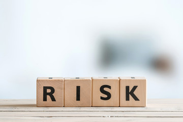 Risk message on a wooden table