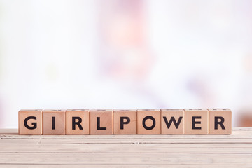 Girlpower sign on a table