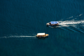 View from the top down by two passenger ship passing by - obrazy, fototapety, plakaty