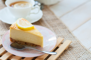 A slice of lemon cheesecake.