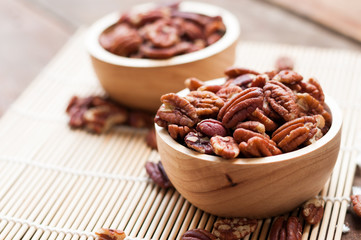 pecan nuts, on wooden board