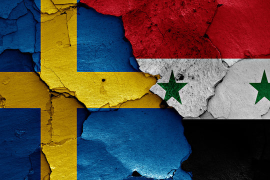 flags of Sweden and Syria painted on cracked wall