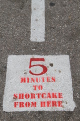 Sign on road indicating waiting time
