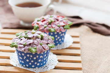 home made sponge cupcakes with flowers buttercream frosting