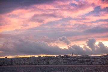 Bright sunset sky over Tangier city, Morocco