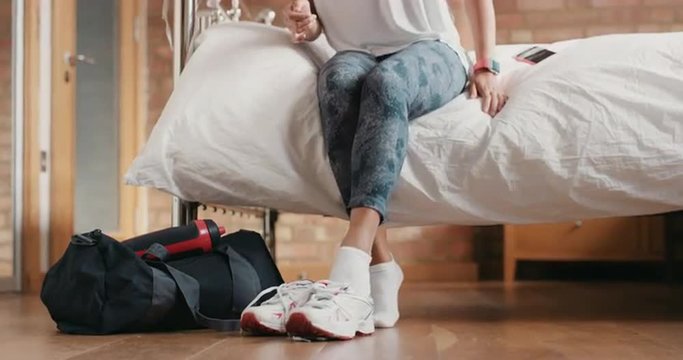 Healthy Woman At Home Getting Ready For Gym Workout With Smart Watch