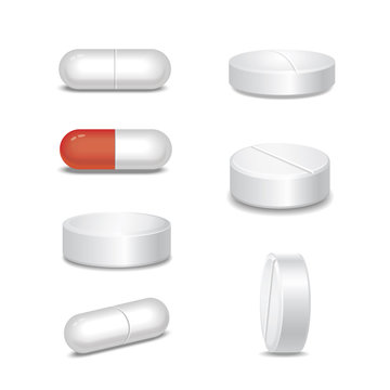 Set of  medical pills in different positions isolated on white 