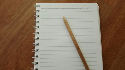 notebook paper with pensil