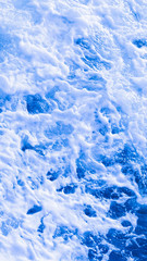 sea wave with white foam vertically