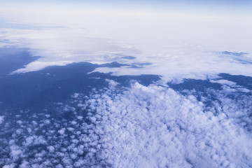 Blue sky with clouds background. view from the window of an airp