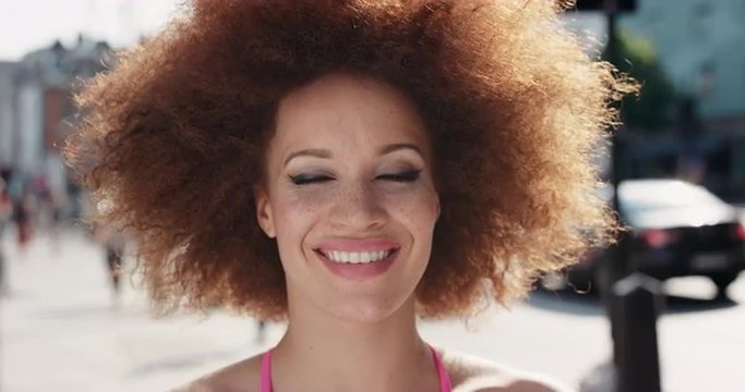 Slow Motion Portrait of funky happy mixed race woman smiling