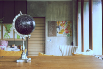 model of black world decorated in living room with furniture
