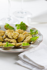 Battered clams on a plate in a restaurant