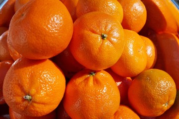 Bowl of ripe orange clementines