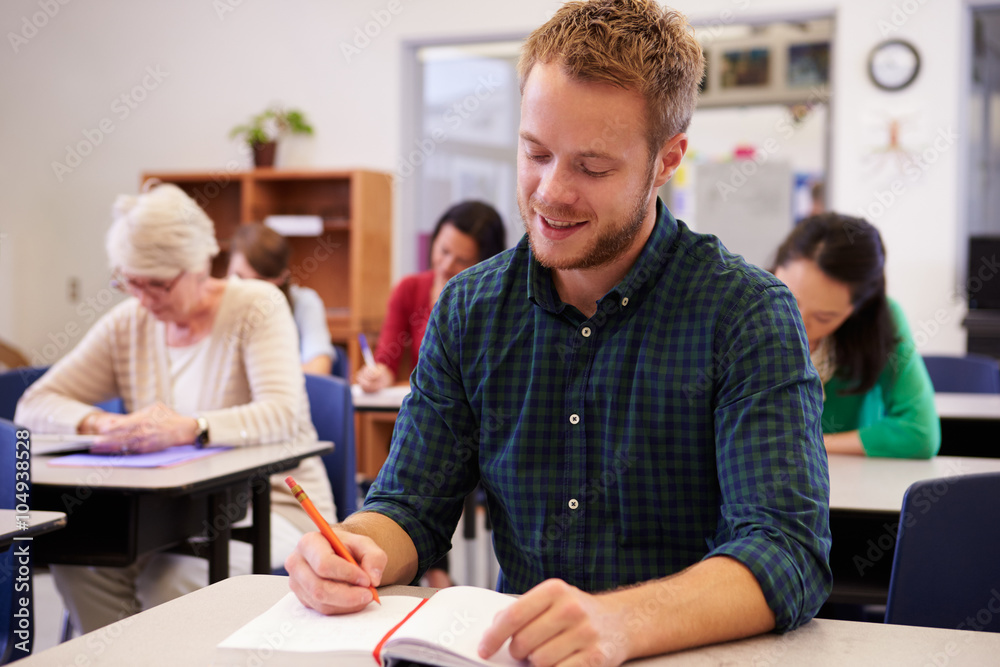 Sticker Young man studying at an adult education class