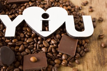 Tiles of dark chocolate and coffee beans 