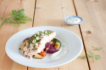 Fillet of salmon with roasted vegetables and yogurt dip