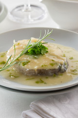 Hake served in a cream sauce