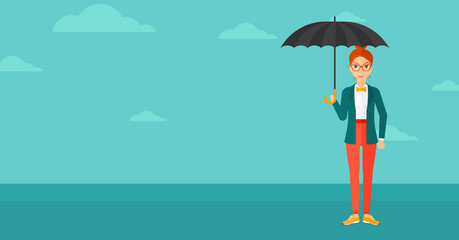 Business woman standing with umbrella.
