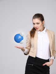 Young woman scientist with model of water molecule.