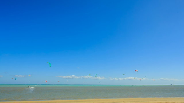 People engaged in kite surfing in the Kite Village at the Red Sea near Hamata Marine.