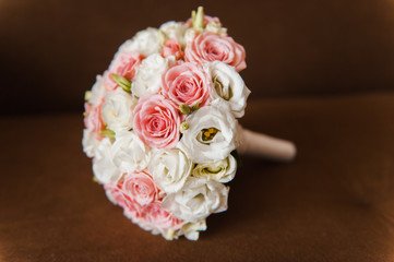 Bridal bouquet of roses on a  wooden planks