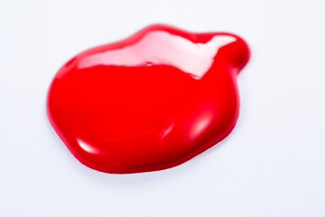 The puddle of an oil paint spill isolated over the white background,