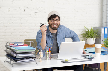 corporate portrait of young hispanic attractive hipster businessman working at modern home office