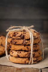 freshly baked chocolate chip cookies on rustic wooden table