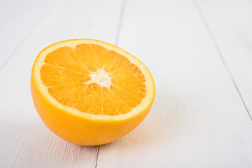 Fresh Orange Slice On Wood Table