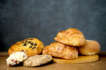 croissant danish and cookie bakery on teak wood table