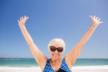 Senior woman raising her arms