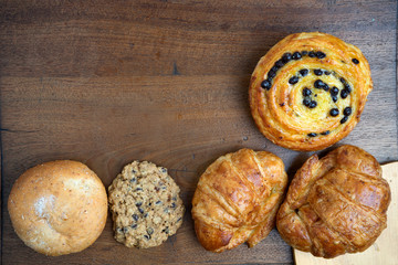 croissant danish and cookie bakery on teak wood