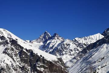 Fototapeta na wymiar Mountain peaks in winter at sunny day