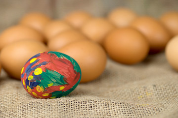 painted egg on burlap