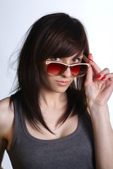 Naklejka premium young beautiful girl with sunglasses