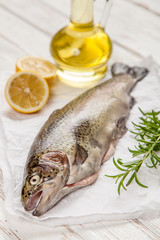 Fresh trout on white wood