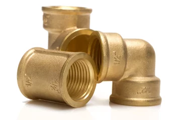 Fotobehang brass fittings for plumbing pipes - gon, tee, sleeve © leonid_shtandel